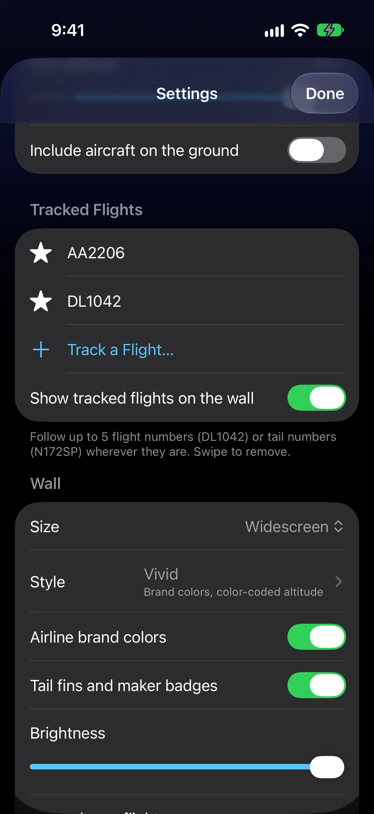 Tracked Flights in Settings: AA2206 and DL1042, Track a Flight, and Show tracked flights on the wall